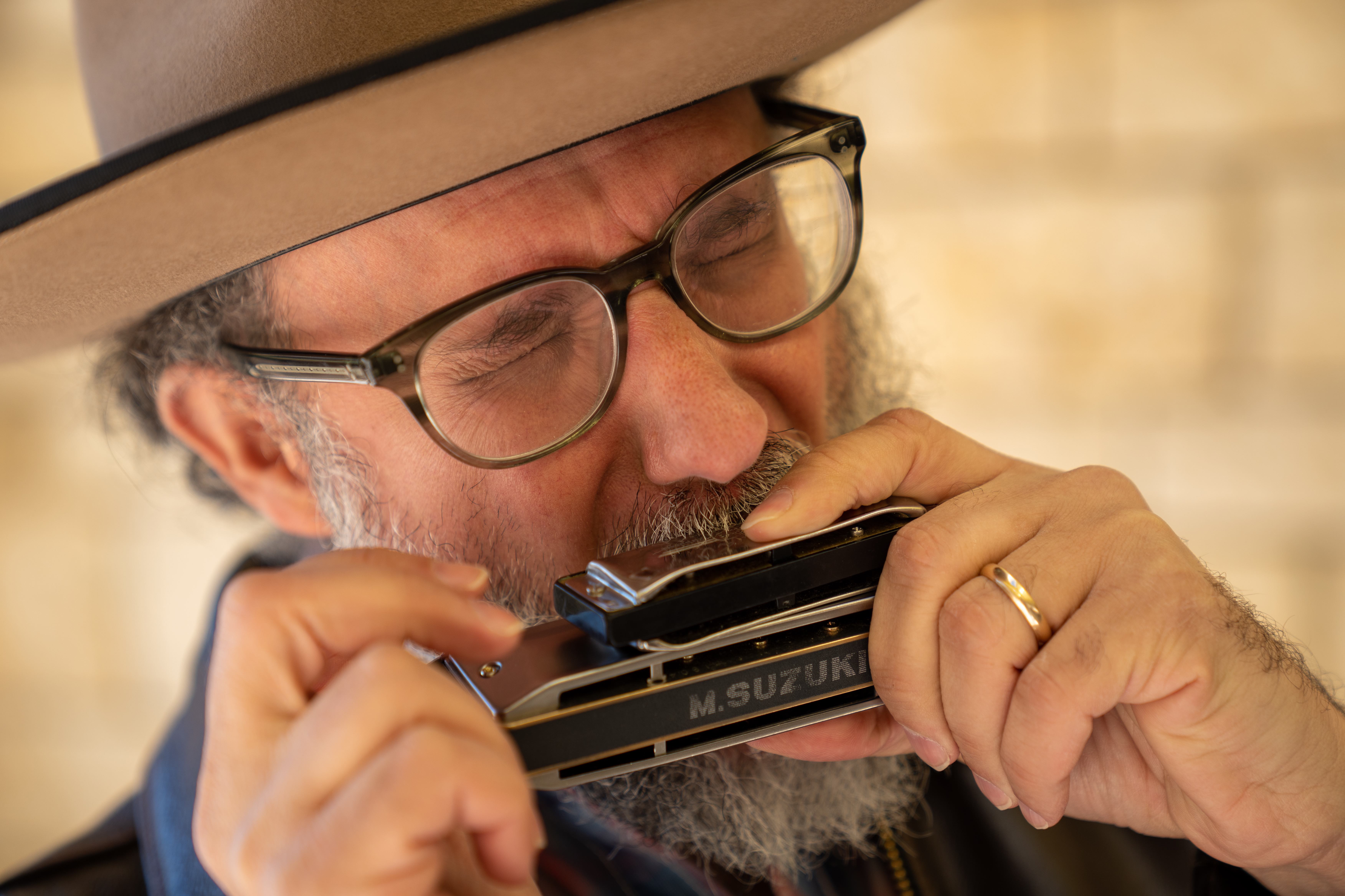 Michael Rubin performing on harmonica